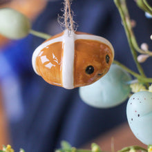 Load image into Gallery viewer, Ceramic Smiling Hot Cross Bun Ornament - Derbyshire Gift Centre