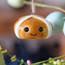 Load image into Gallery viewer, Ceramic Smiling Hot Cross Bun Ornament - Derbyshire Gift Centre