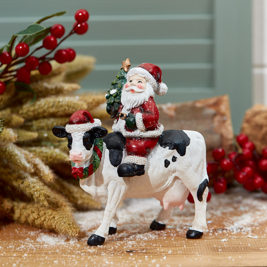 Resin Santa On A Cow Christmas Decoration
