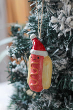 Load image into Gallery viewer, Ceramic Festive Hotdog With Santa Hat Ornament
