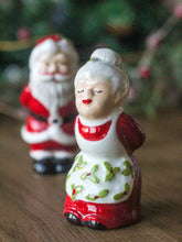 Load image into Gallery viewer, Ceramic Kissing Mr &amp; Mrs Clause Salt and Pepper Set
